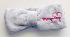 New In Package Mary Kay Light Gray Big Bow Headband with Pink Embroidered Logo