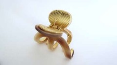 Medium brown beige gold tone textured acrylic and metal hair claw clip