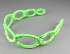 Green satin wrapped fabric 1 3/8″ wide headband oval chain link cut out pattern
